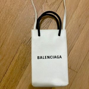 Balenciaga phone bag with strap.